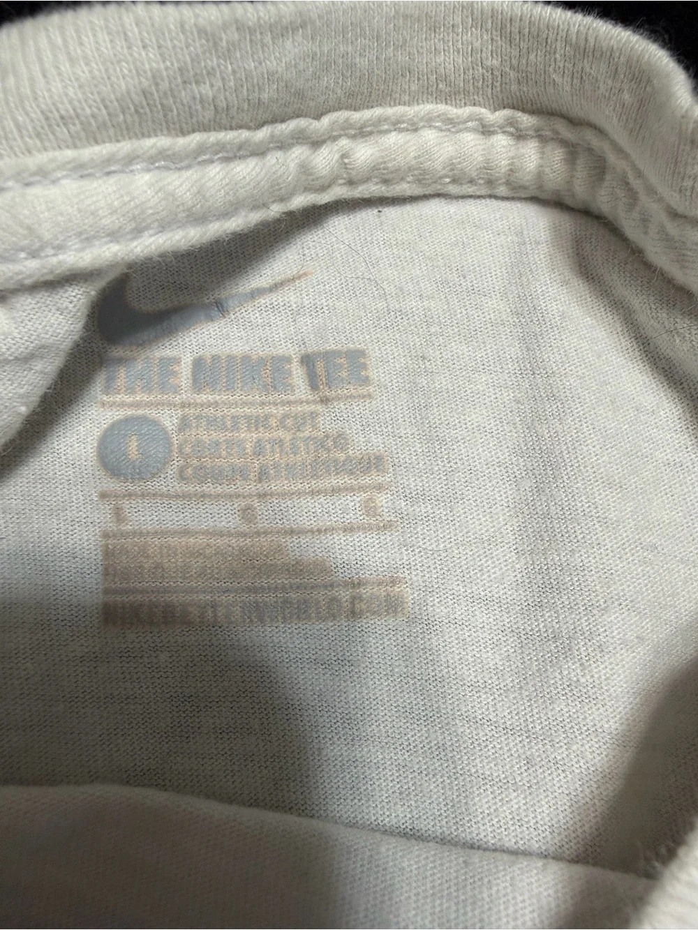 Nike White Tee with Subtle Blue Swoosh and Text